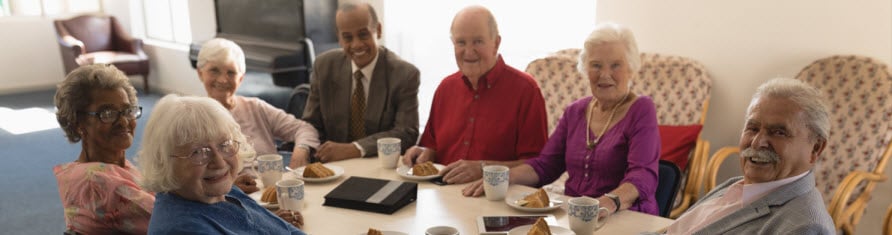 nursing home patients sitting at table