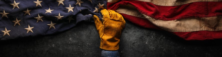 union worker with glove holding american flag