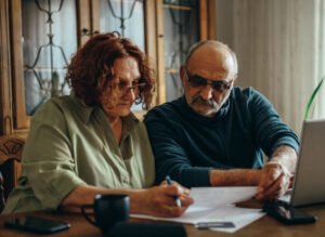 couple doing some paperwork at home
